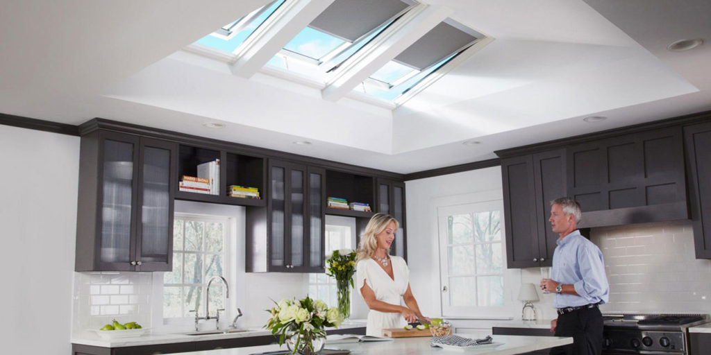 Venting skylights in brown kitchen.