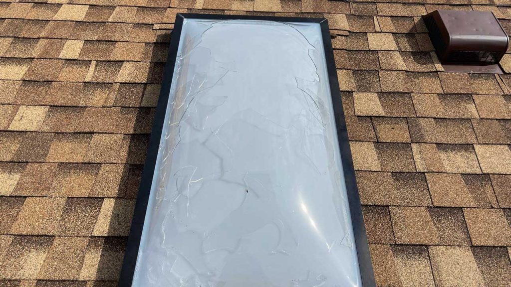 An image showing a hail damaged skylight.