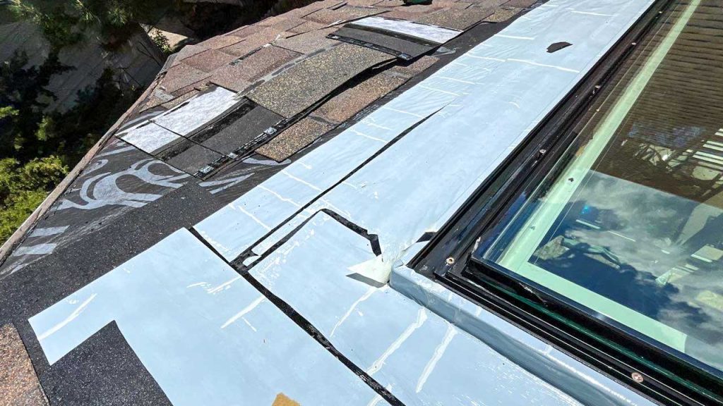 A sticky underlayment surrounds the skylight.