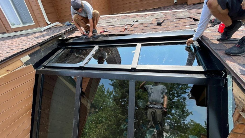 Finishing the glass and flashing installation.