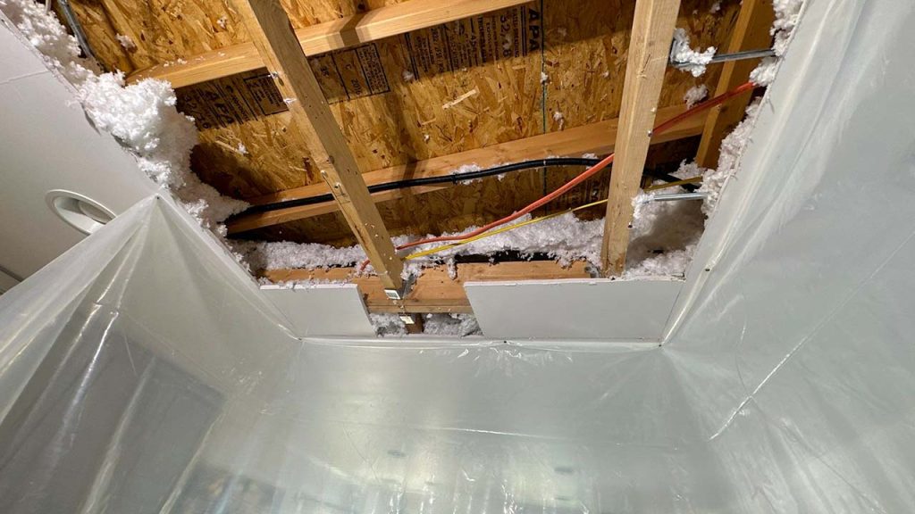 An image of the opening cut in the ceiloing drywall.