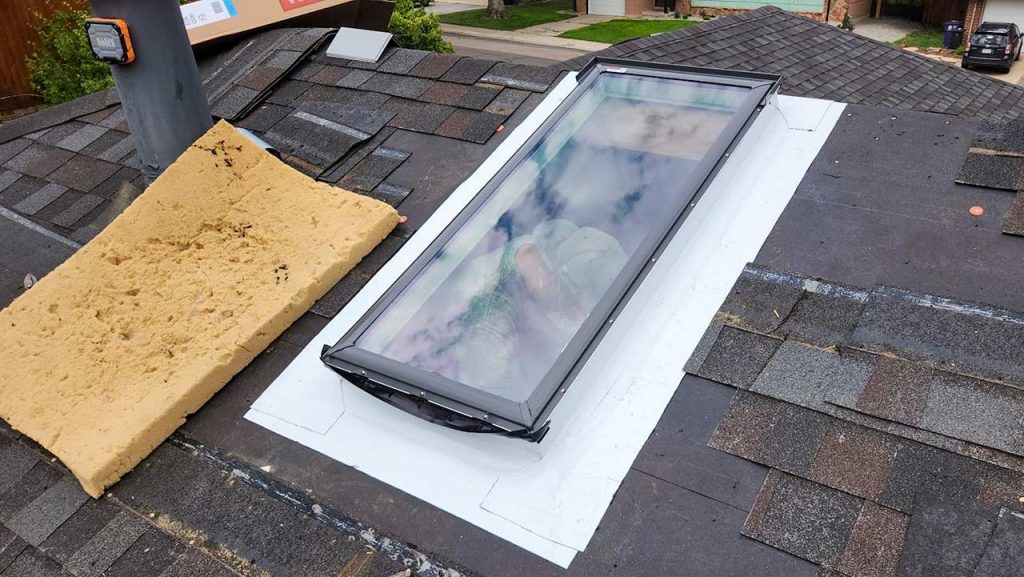 The skylight has been surrounded with a sticky underlayment.