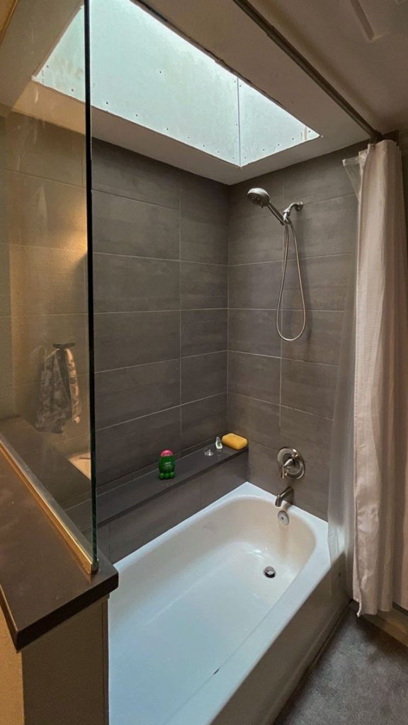 An image of the skylight shaft above the bathtub.