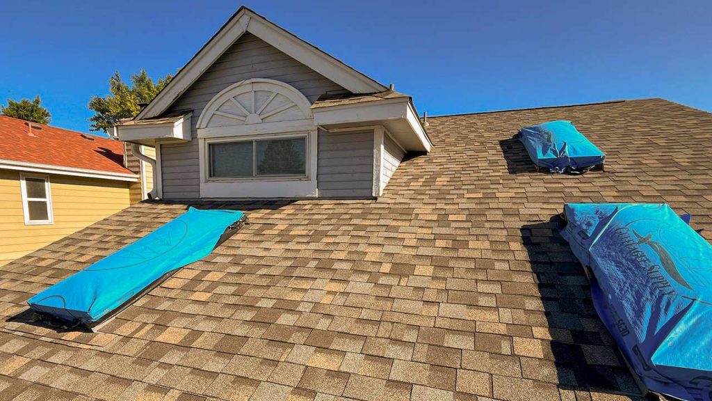 An image showing the three skylights covered with tarps.