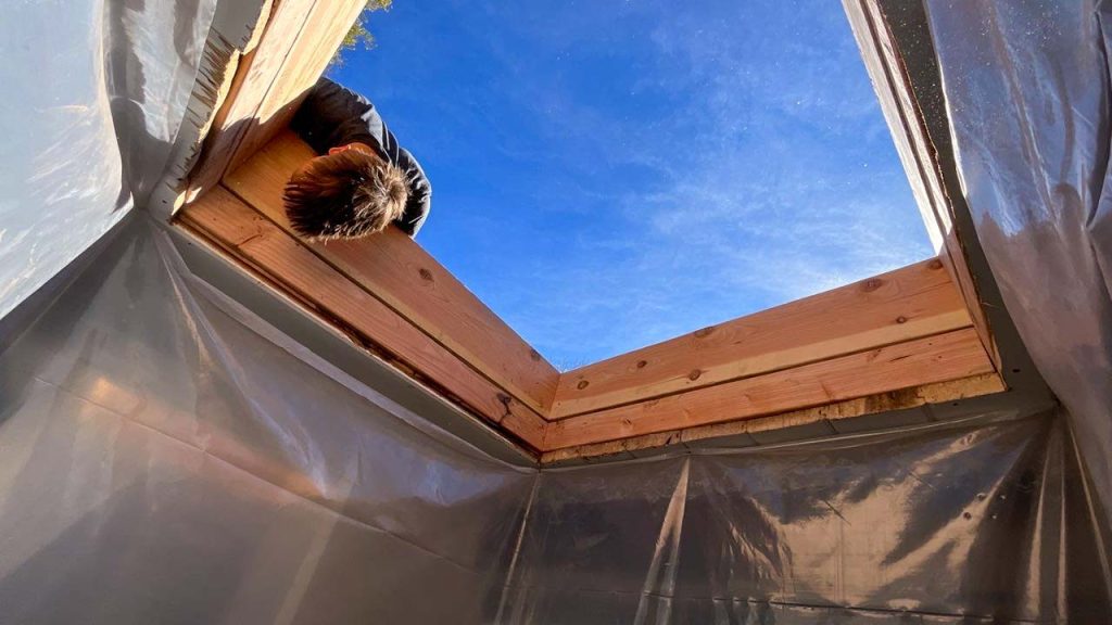 The skylight shaft is lined with lumber prior to attaching drywall.