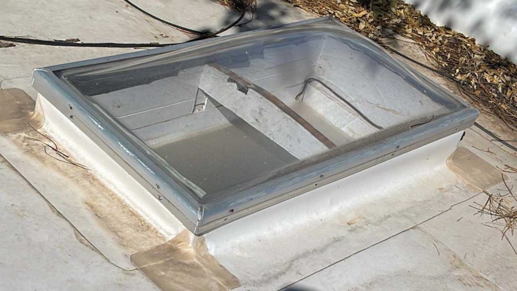 An image of one of the 2 foot by 4 foot dome skylight on the roof.