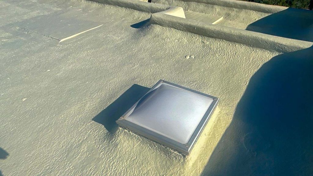 An image of an acrylic dome skylight on the roof to be replaced.