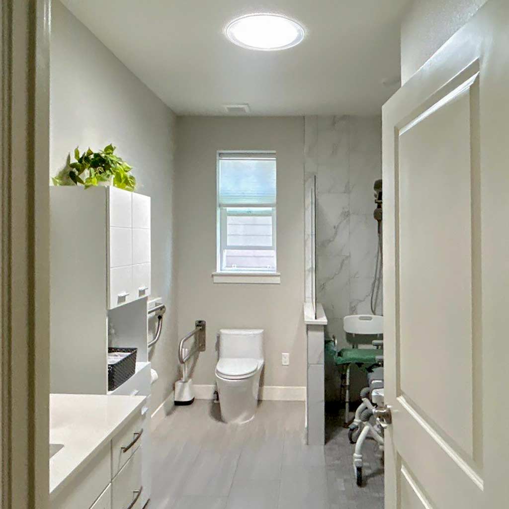 Looking through a door into a bathroom with a Sun Tunnel.