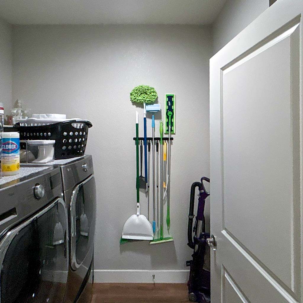 Looking through a door into a laundry with a Sun Tunnel.