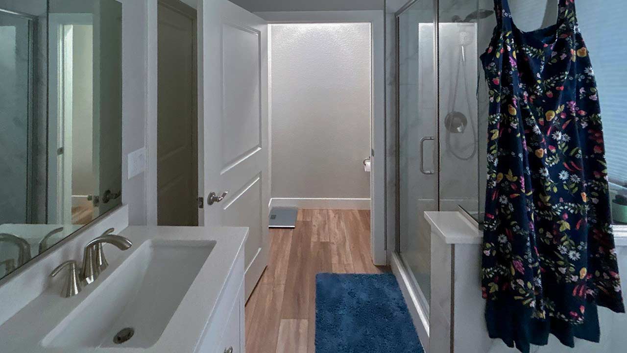 Looking through a door into a bathroom with a Sun Tunnel.