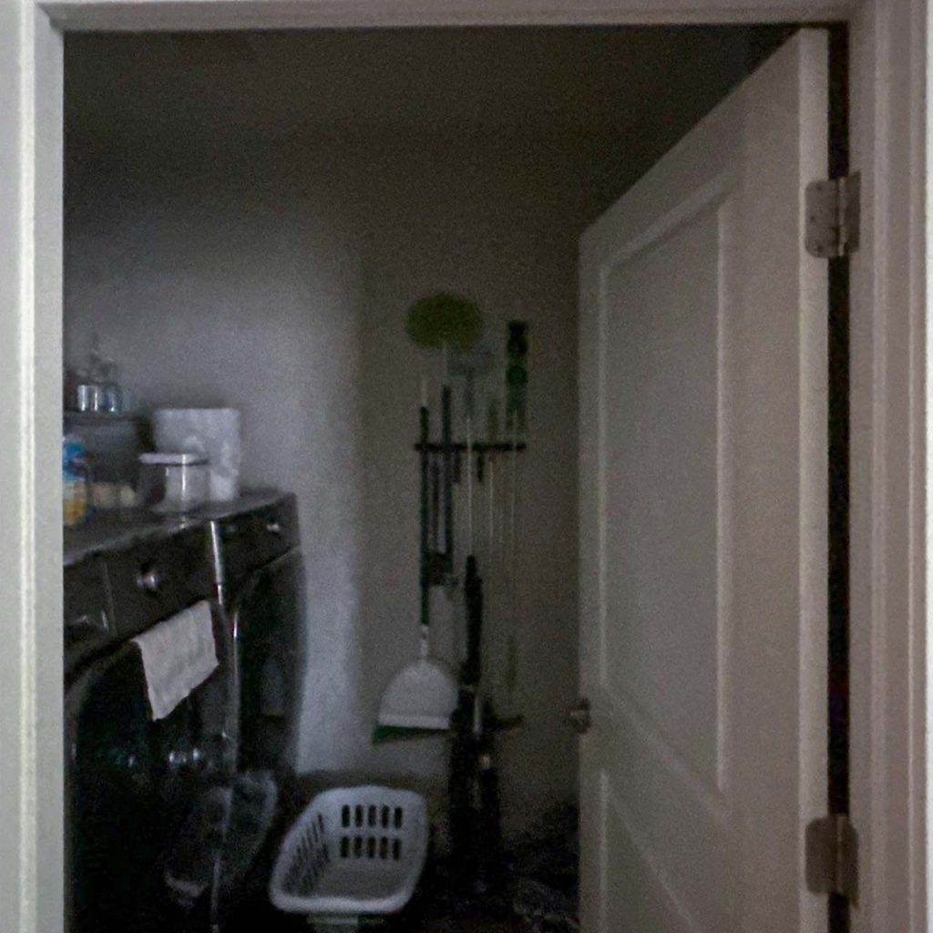 Looking through a door into a laundry without a Sun Tunnel.