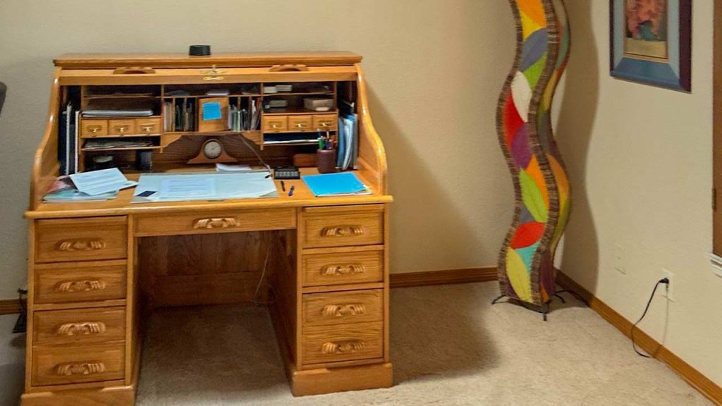 The desk in the office is illuminated by the Sun Tunnel above.