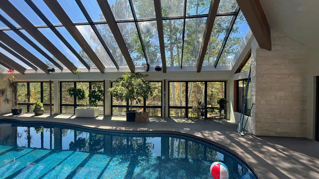 Skylight glazing system above an indoor swimming pool.